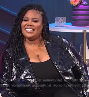 Nina's black leather trench coat on E! News Nightly Pop