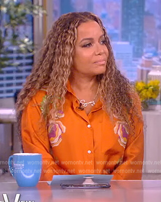 Sunny's orange floral satin blouse and pants on The View