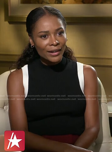 Zuri's black sleeveless top with contrast trim on Access Hollywood