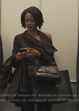 Jax's satin one shoulder blouse on Reasonable Doubt