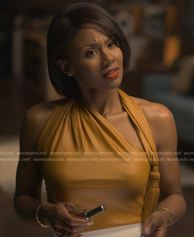 Jax's orange top with tassel on Reasonable Doubt