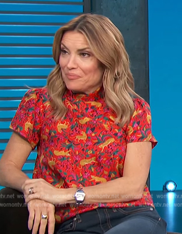 Kit's red animal print short sleeve top on Access Hollywood