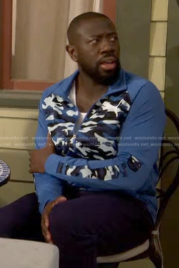 Malcolm's blue camo panel jacket on The Neighborhood