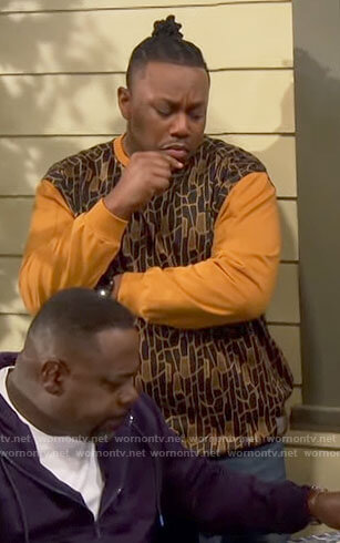 Marty's yellow and brown printed sweatshirt on The Neighborhood