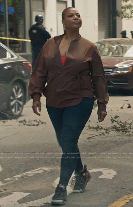 Robyn's brown tie waist top, V earrings and sneakers on The Equalizer
