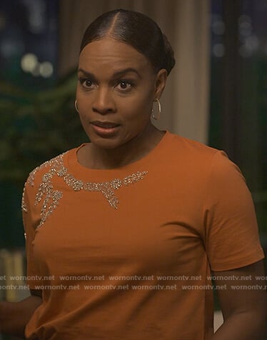 Sally's orange embellished tee on Reasonable Doubt
