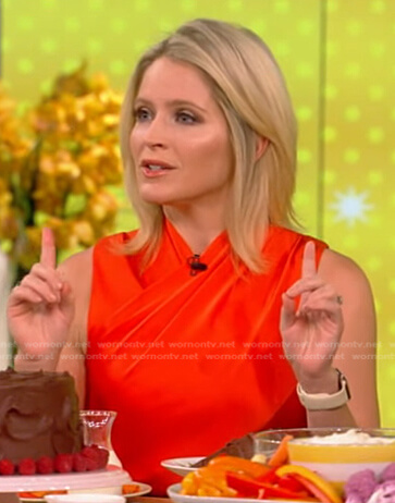 Sarah's orange cross front top and black high waist pants on The View