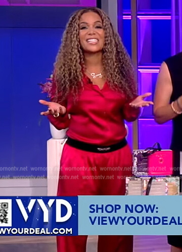 Sunny's pink satin blouse and logo pants on The View