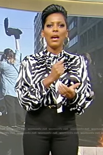 Tamron's zebra stripe blouse on Tamron Hall Show
