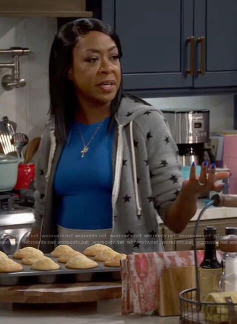 Tina's grey star print hoodie on The Neighborhood