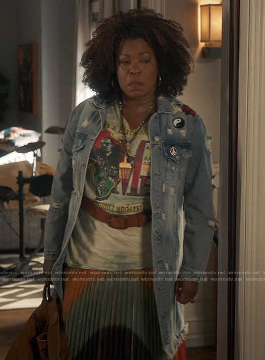 Vi's ME graphic tee and pleated striped skirt on The Equalizer