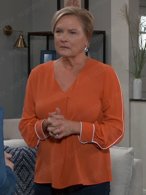 Carolyn's orange blouse with white piping on General Hospital