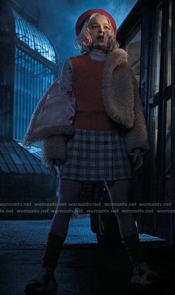 Enid's pink fluffy jacket, floral top and sweater vest on Wednesday