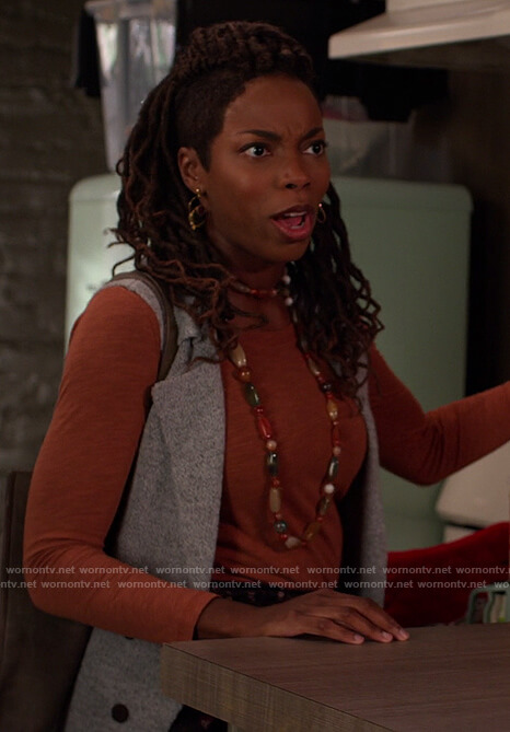 Denise's orange long sleeve tee on Home Economics