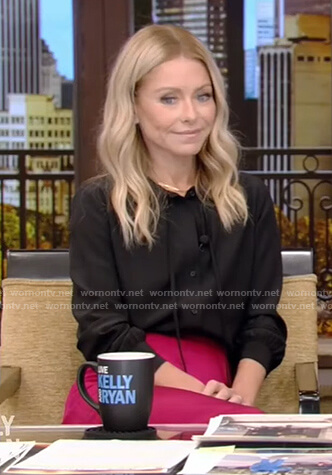 Kelly's black tie neck blouse and pink skirt on Live with Kelly and Ryan