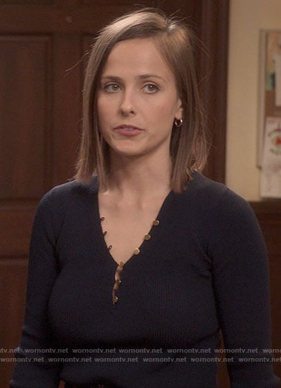 Kimberly's navy henley top with gold buttons on The Sex Lives of College Girls