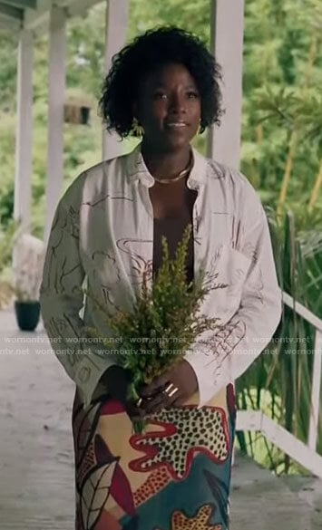 Nova's white drawing print shirt and fanned earrings on Queen Sugar