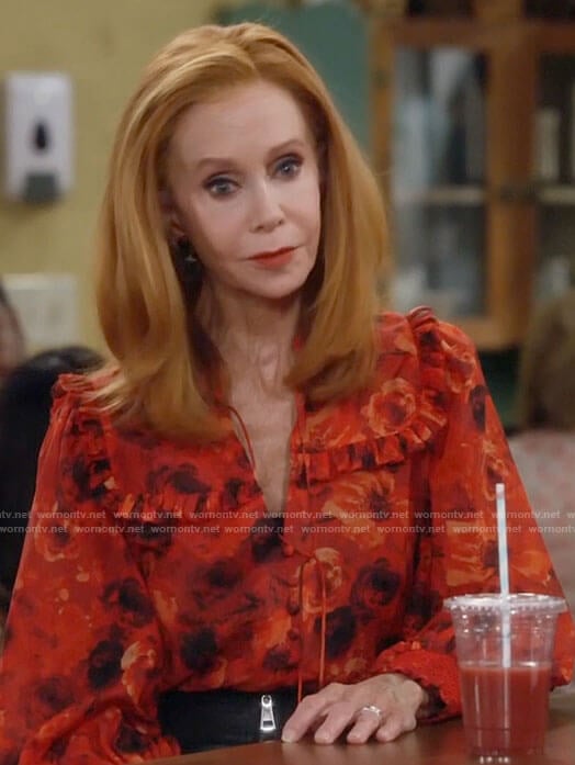 Sheila's red floral blouse with ruffles on Call Me Kat