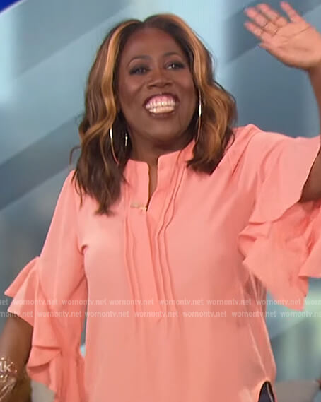 Sheryl's coral ruffle sleeve blouse on The Talk