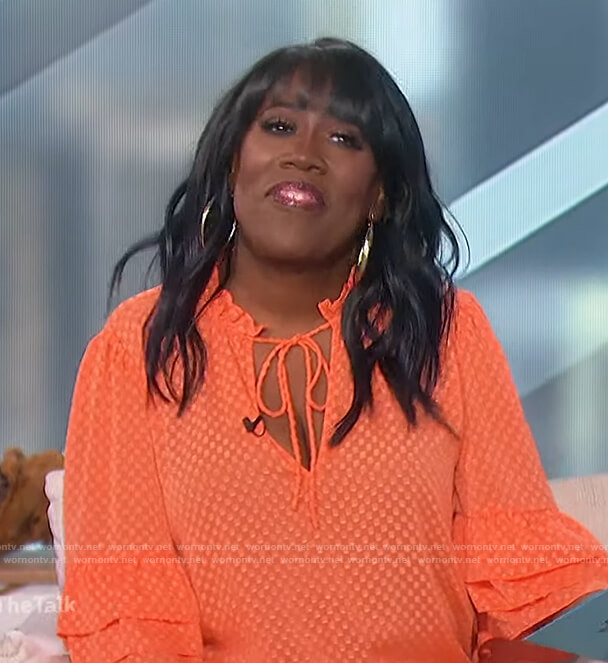 Sheryl's orange bell sleeve blouse on The Talk