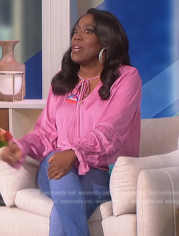 Sheryl's pink satin tie neck blouse on The Talk