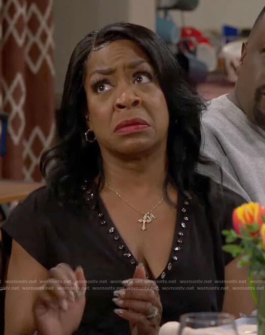 Tina's black embellished v-neck tee on The Neighborhood