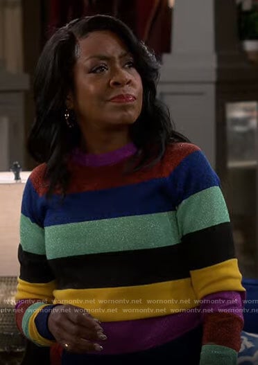 Tina's multi colored striped sweater on The Neighborhood