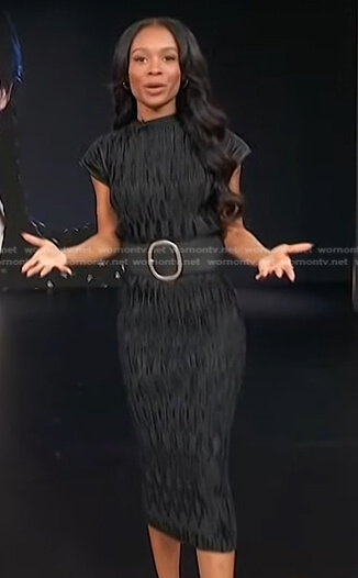 Zuri's black pleated top and skirt on Access Hollywood