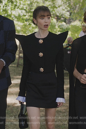 Emily's black pointed shoulders top on Emily in Paris