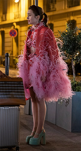 Emily's feather cape and pink cutout dress on Emily in Paris Season 3