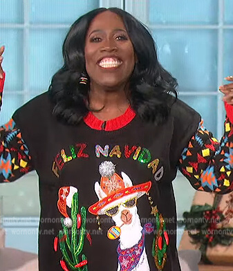 Sheryl's black embellished Christmas sweater on The Talk
