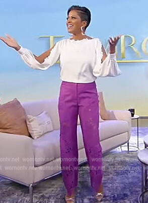 Tamron's white split sleeve blouse and lace pants on Tamron Hall Show