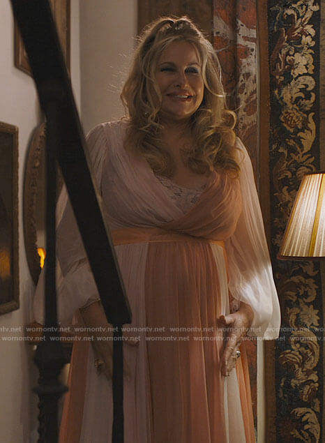 Tanya's coral pink pleated wrap dress on The White Lotus