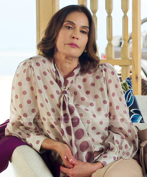 Dolly's polka dot blouse and perforated loafers on Fantasy Island