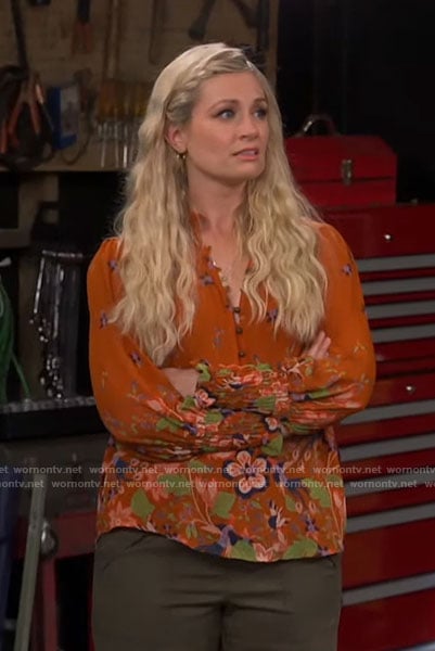 Gemma's orange floral top on The Neighborhood