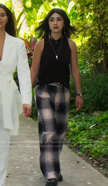 Helene's plaid pants and tassel earrings on Fantasy Island