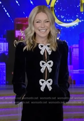 Kelly's blue velvet bow embellished jumpsuit on Live with Kelly and Ryan