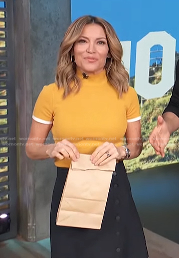 Kit's yellow top and belted skirt on Access Hollywood