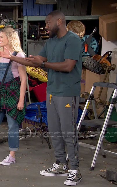 Malcolm's Adidas sweatpants and camo sneakers on The Neighborhood