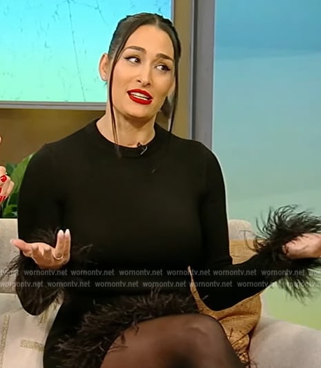 Nikki Bella's black feather trim mini dress on Tamron Hall Show