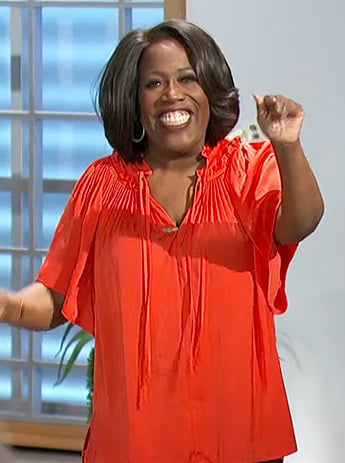 Sheryl's red pleated tie neck blouse on The Talk
