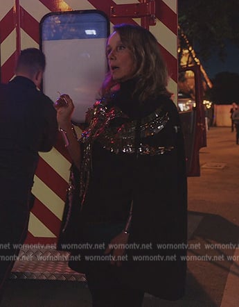 Sylvie's black bird embellished cape on Emily in Paris