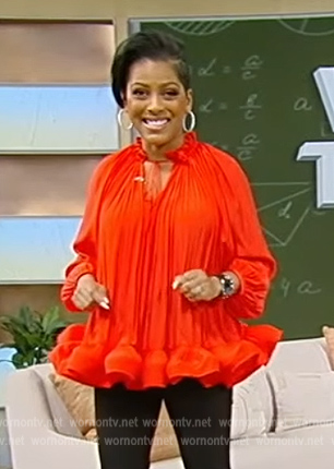 Tamron's red ruffled hem blouse on Tamron Hall Show
