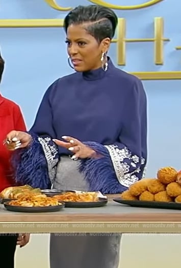 Tamron's blue embroidered fringe trim top on Tamron Hall Show