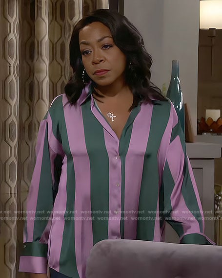 Tina's pink and green striped shirt on The Neighborhood