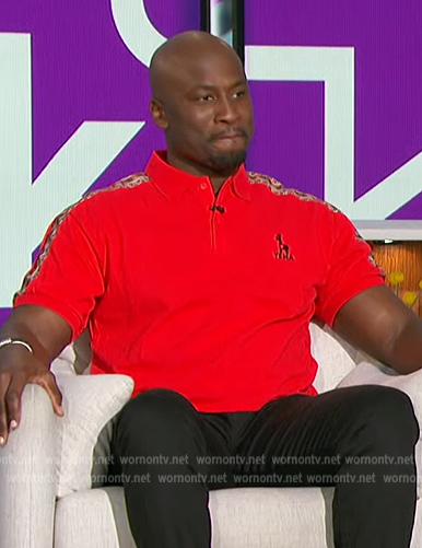Akbar's red polo shirt on The Talk