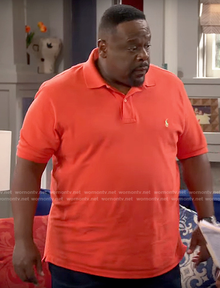 Calvin's orange polo shirt on The Neighborhood
