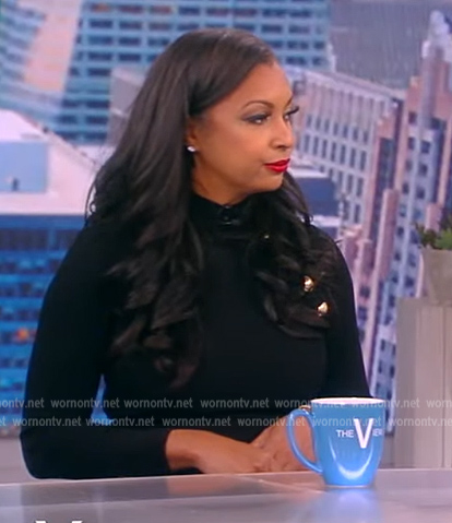 Eboni K. Williams' black button shoulder dress on The View