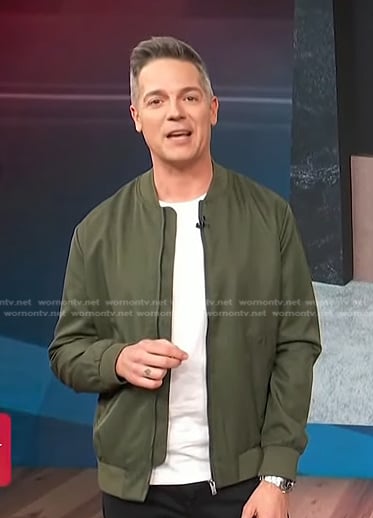 Jason Kennedy's green bomber jacket on Access Hollywood
