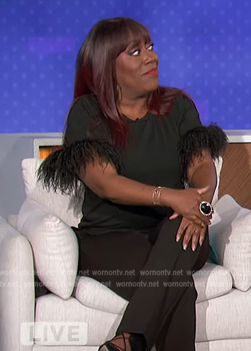 Sheryl's black feather trim top on The Talk